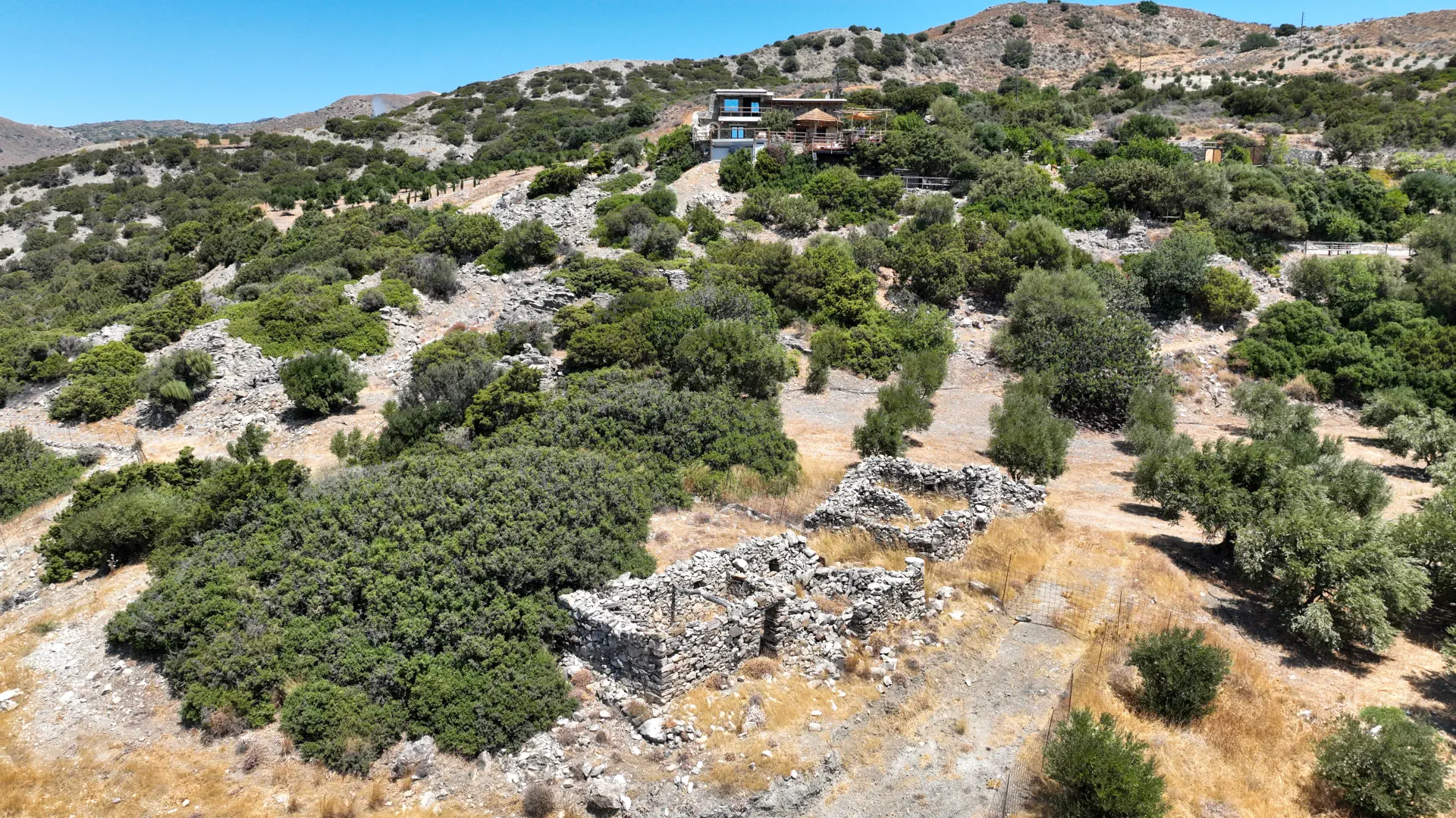 The stone walls of the original metochi below Vorénia Horizon, high in the mountains of South Crete