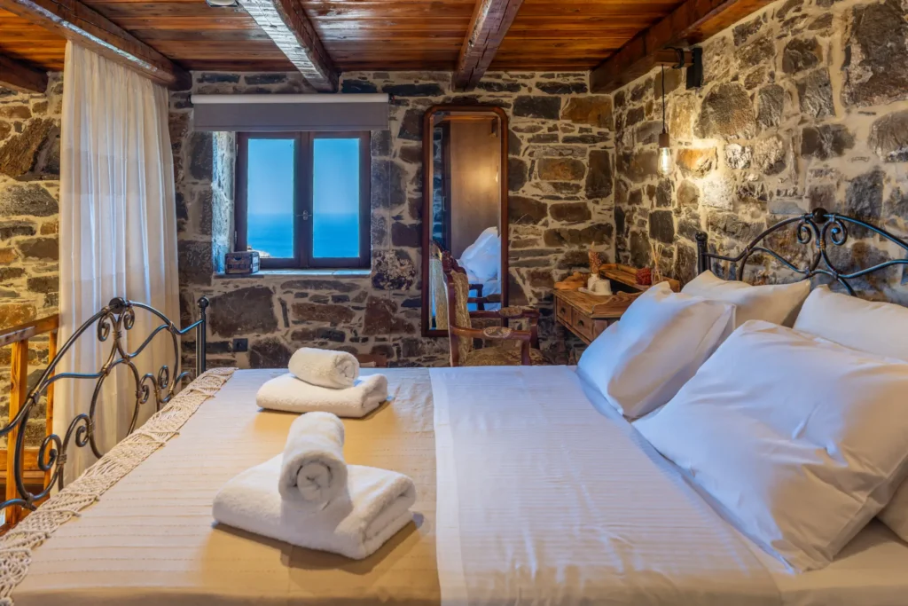 Bedroom in the main stone house at Vorénia Horizon, South Crete