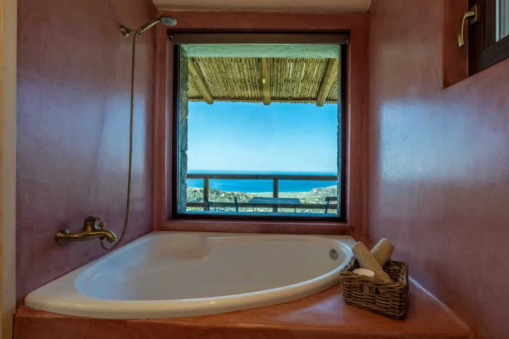 Bathroom of the independent suite at Vorénia Horizon, with bathtub and sea view